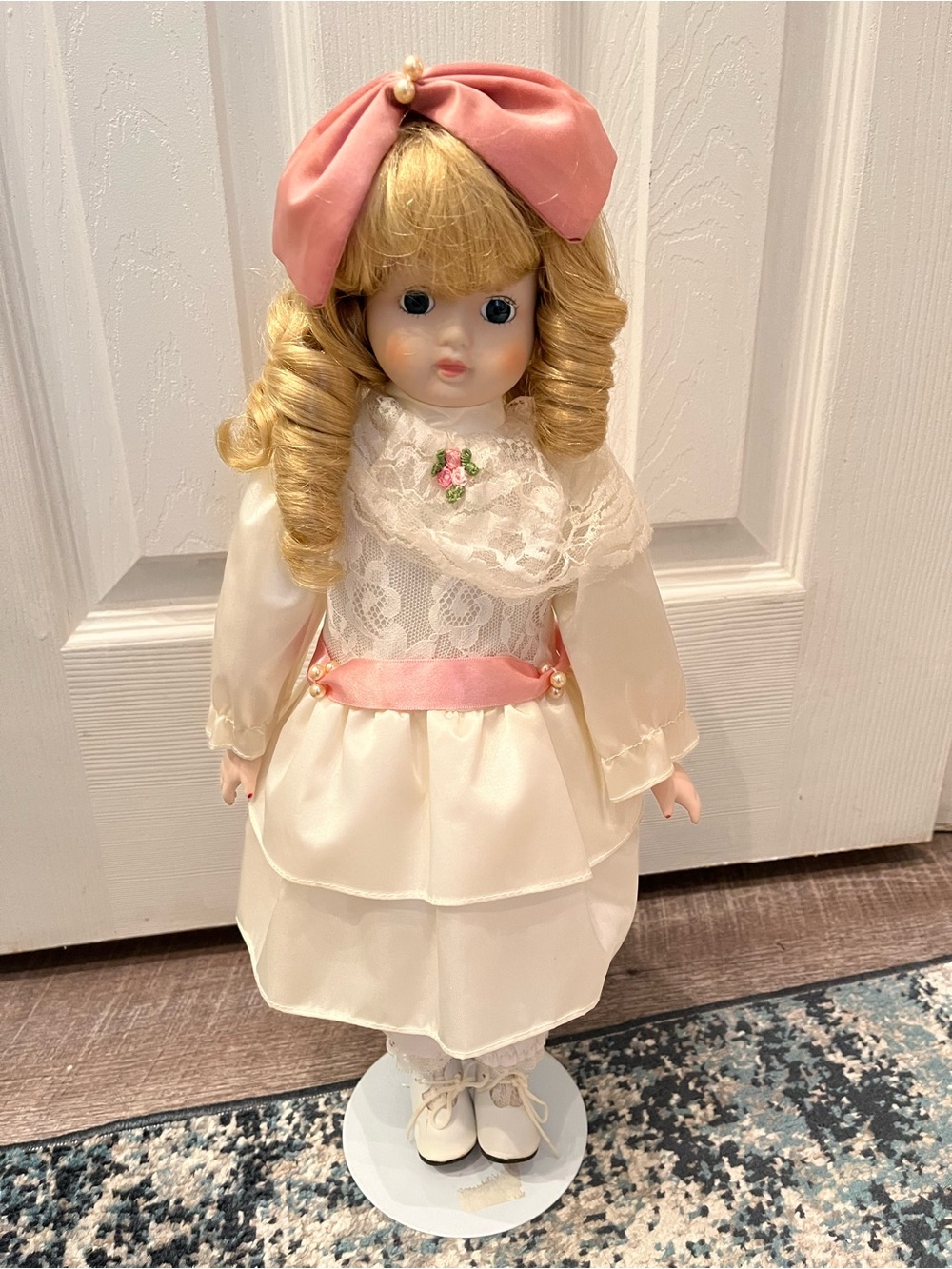 Porcelain-Style Ivory Doll with Pink Bow and Satin Trim